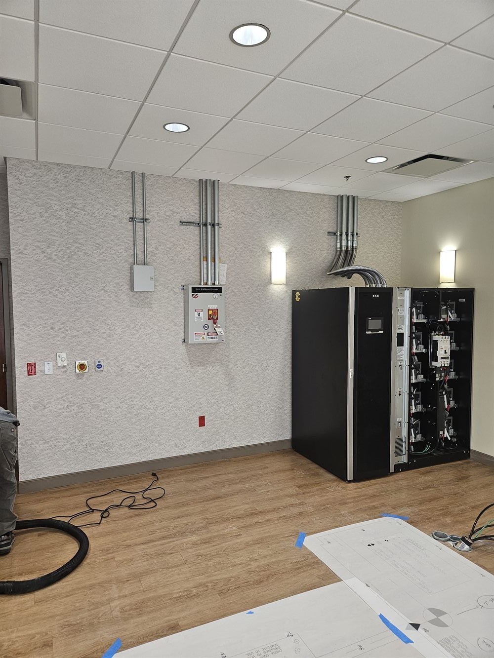 Commercial equipment room with electrical and mechanical service work